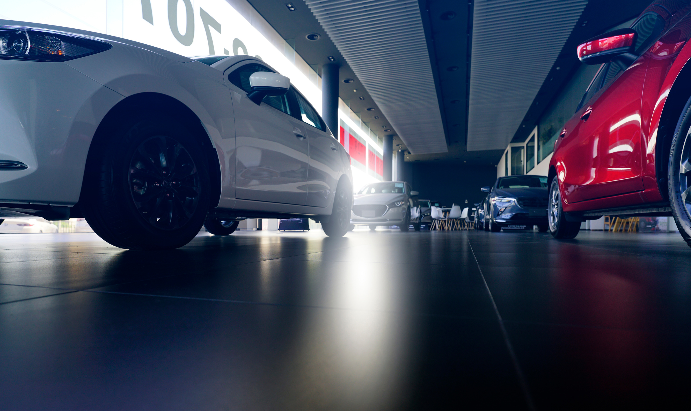 Car parked in luxury showroom. Car dealership office. New car pa